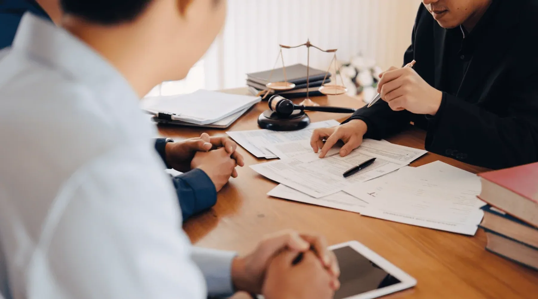 Lawyer reviewing documents during a consultation